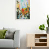 Framed vejigante mask painting with Flatiron Building displayed in a modern living room.